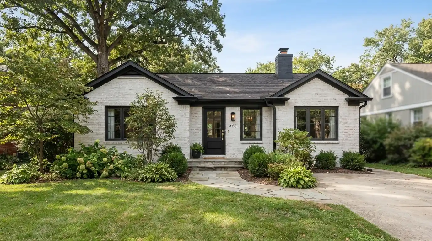 Brick ranch with soft white limewash and charcoal trim